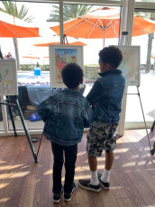 Two young attendees view the winning posters