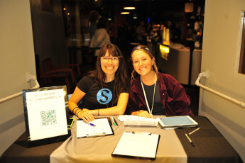 SW staff member Natalie Perez-Regalado and volunteer Molly McGee at check in
