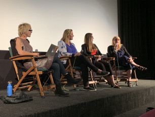 Panelists answer questions after the film