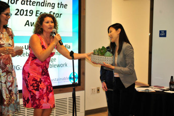 Co-Ed Susy Borlido presents SW Advisory Board Chair Vicki Liao with a gift