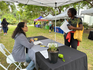 Attendee learns about Sustainable Works